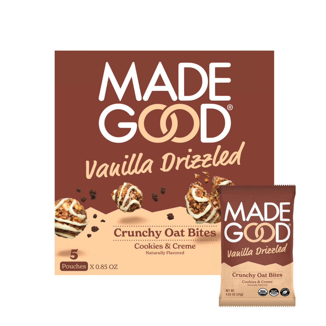 A box of MadeGood vanilla drizzled crunchy oat bites in cookies & creme flavor