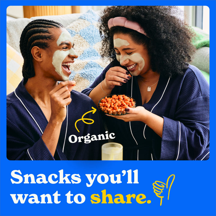 Snacks you'll want to share: two people happily eating star puffed crackers